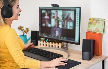 Woman with headset on talking on a video call